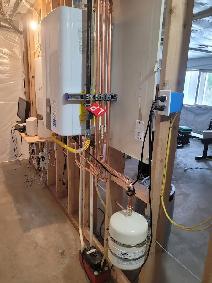 Licensed plumber repairing a kitchen sink in Perryville